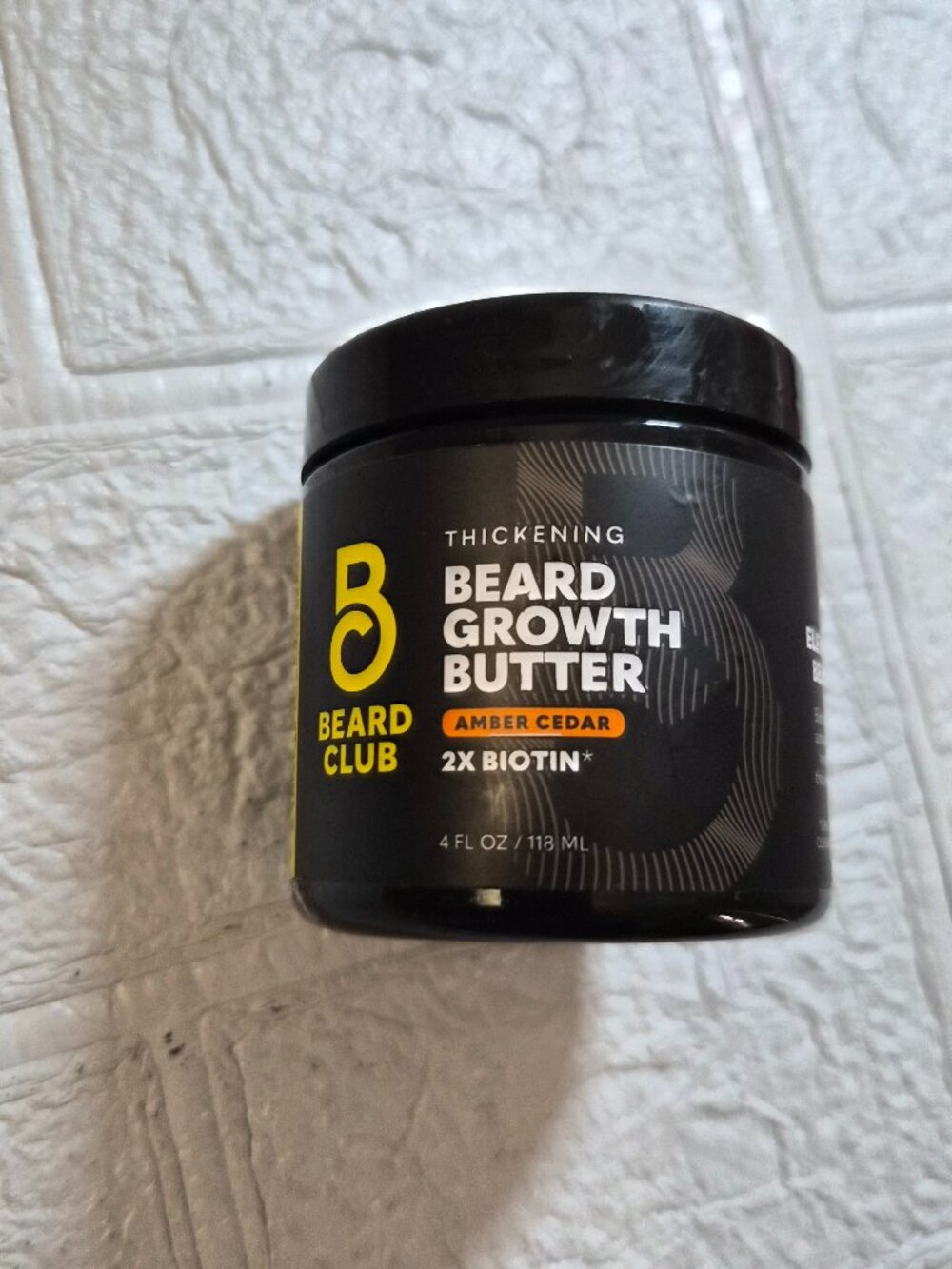 4 fl oz jar of Beard Club Thickening Beard Growth Butter in amber cedar scent